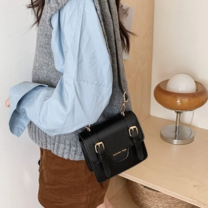 Classic black vintage school messenger bag for kids with gold metal buckle accents
