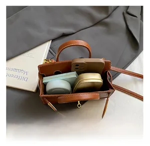 Interior view of brown tote bag with contrast stitching showing spacious daily capacity