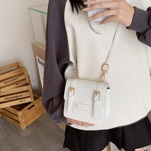 White vintage faux leather messenger bag for kids with fashion bag print and gold buckles