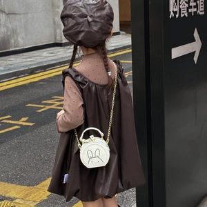 Cute white bunny round shoulder bag with chain strap for kids styled with a brown dress
