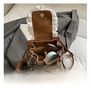 Detail showing internal capacity of sweet lace plaid girl backpack with items