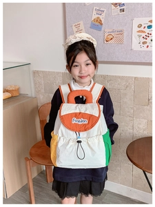 Close-up of color-block children's backpack featuring Fashion print and drawstring closure