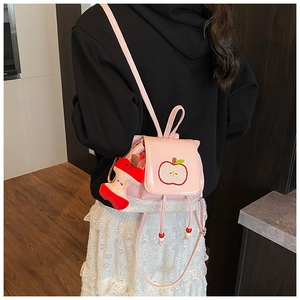 Pink girls backpack with apple embroidery and white polka dots on smooth PU leather