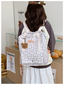 Quilted floral kids backpack with Merci embroidery and brown plush bear charm
