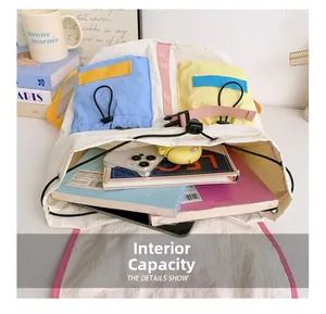 Detail showing the large interior capacity of this stylish color-block kids backpack