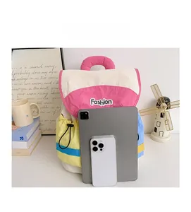 Fashionable color-block kids backpack shown with a tablet to demonstrate storage capacity