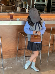 Classic brown leather mini handbag for kids styled with an autumn fashion outfit