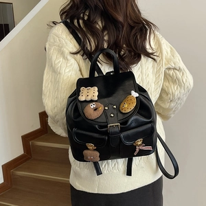 Cute black leather kids backpack with plush food patches and a red checkered bow