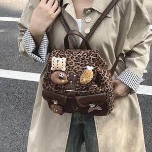 Kids leopard print plush backpack with cute doll charms and vintage brown leather straps