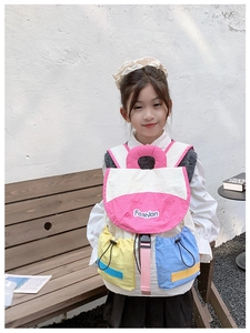 Detail of color-block kids backpack with Fashion print and functional drawstring pockets