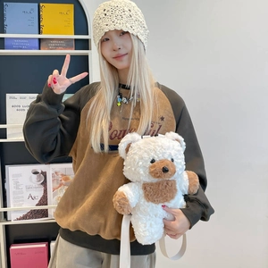 Cute plush bear backpack with soft curly fur and adjustable white straps for kids