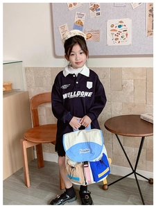Detailed view of kids' color-block backpack with Fashion print and drawstring closure