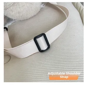 Detail of adjustable cream white woven strap with black buckle on kids backpack