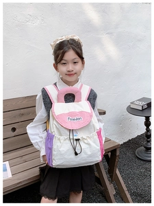 Detail of color-block backpack with drawstring closure and Fashion embroidery