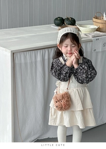 Close-up of a floral shirt with tiered dress and cute plush bear crossbody bag for girls