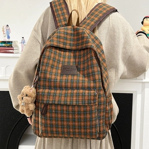Kids vintage plaid backpack in brown and blue with cute plush puppy charm