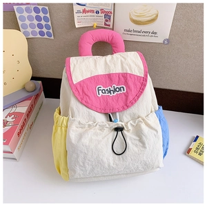 Detail of color-block kids backpack with Fashion patch embroidery and drawstring pocket