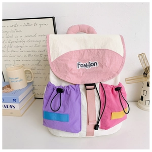 Detail view of colorful patchwork backpack with drawstring pockets and Fashion patch