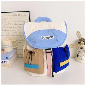 Detail of color-block kids backpack with Fashion patch and functional drawstring pockets
