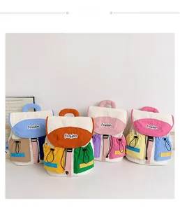 Macro detail of fashionable color-block backpacks with drawstring pockets and fashion logos