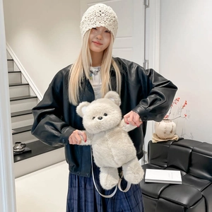 Cute plush bear backpack for children with fluffy texture and soft white straps