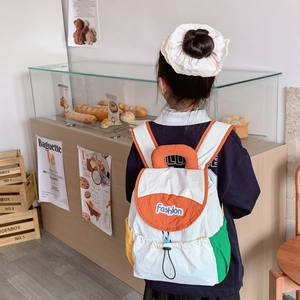 Lightweight contrast color kids backpack in cream and orange with drawstrings