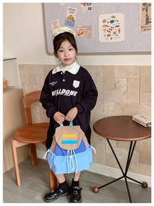 Kid style photoshoot featuring a trendy three-color contrast drawstring backpack for school