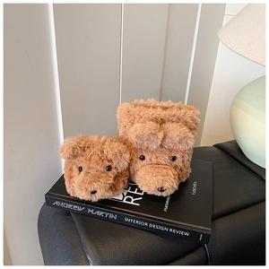 Detail of cute brown plush teddy bear crossbody bags for kids shown on design books