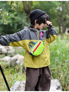 Kids outdoor crossbody bag in colorful nylon showing adjustable strap and sporty design