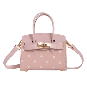 Pink polka dot mini crossbody bag with gold hardware and top handle for kids
