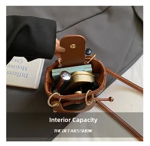 Internal capacity of quilted brown leather mini bag with lipstick and makeup items