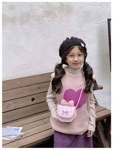 Pink plaid kids shoulder bag with lace edges and bow detail worn by a child