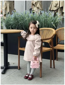 Pink quilted mini handbag for kids styled with a sweet princess dress and accessories