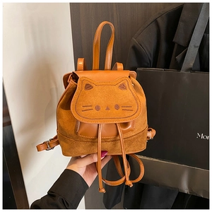 Detailed view of brown cartoon cat backpack with soft suede texture and embroidery