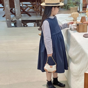 Girl's retro forest style blue vest dress and checkered shirt with a beige mini chain bag