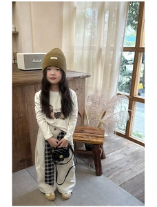 Girl's fashion outfit with quilted mini shoulder bag and autumn knit beanie style
