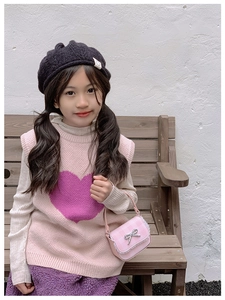 Pink checkered bow handbag paired with knitted heart vest and plush purple pants