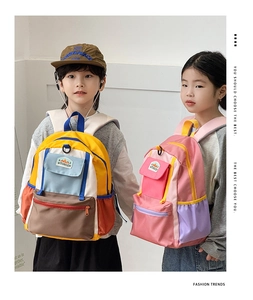 Detail view of colorful patchwork schoolbag for kids with vibrant color-block design