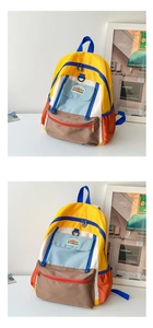 Detail of multi-color block kids backpack with front flap pocket and woven label