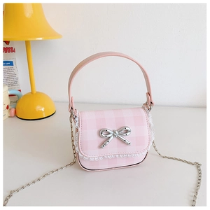 Close-up of pink plaid mini handbag with white lace trim and silver bow metallic buckle