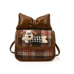 Mini plaid crossbody bag for kids featuring a 3D Gromit plush puppy and a large brown bow