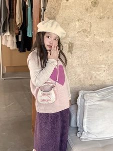 Toddler girl wearing pink heart vest and beige beret with a white bow crossbody bag
