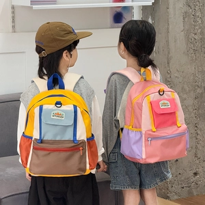 Waterproof nylon kids backpack with colorful patchwork design for primary school students