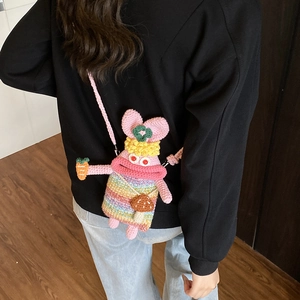 Handmade crochet bunny crossbody bag with colorful stripes and carrot detail for kids