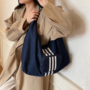 Minimalist denim tote bag for women with decorative stripes in urban casual style