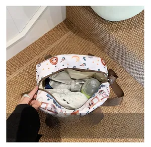 Detailed interior of cartoon nursery bag showing space for baby bottles and diapers