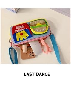 Internal storage detail of kids crossbody bag showing phone, glasses and snacks