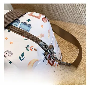 Detail of premium silver metal zipper and hardware on the cute animal print diaper bag