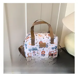 Close-up of animal print storage bag with adjustable brown strap and leather logo