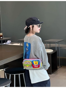 Kids colorful crossbody bag featuring embroidered burger and fries pattern on a canvas strap